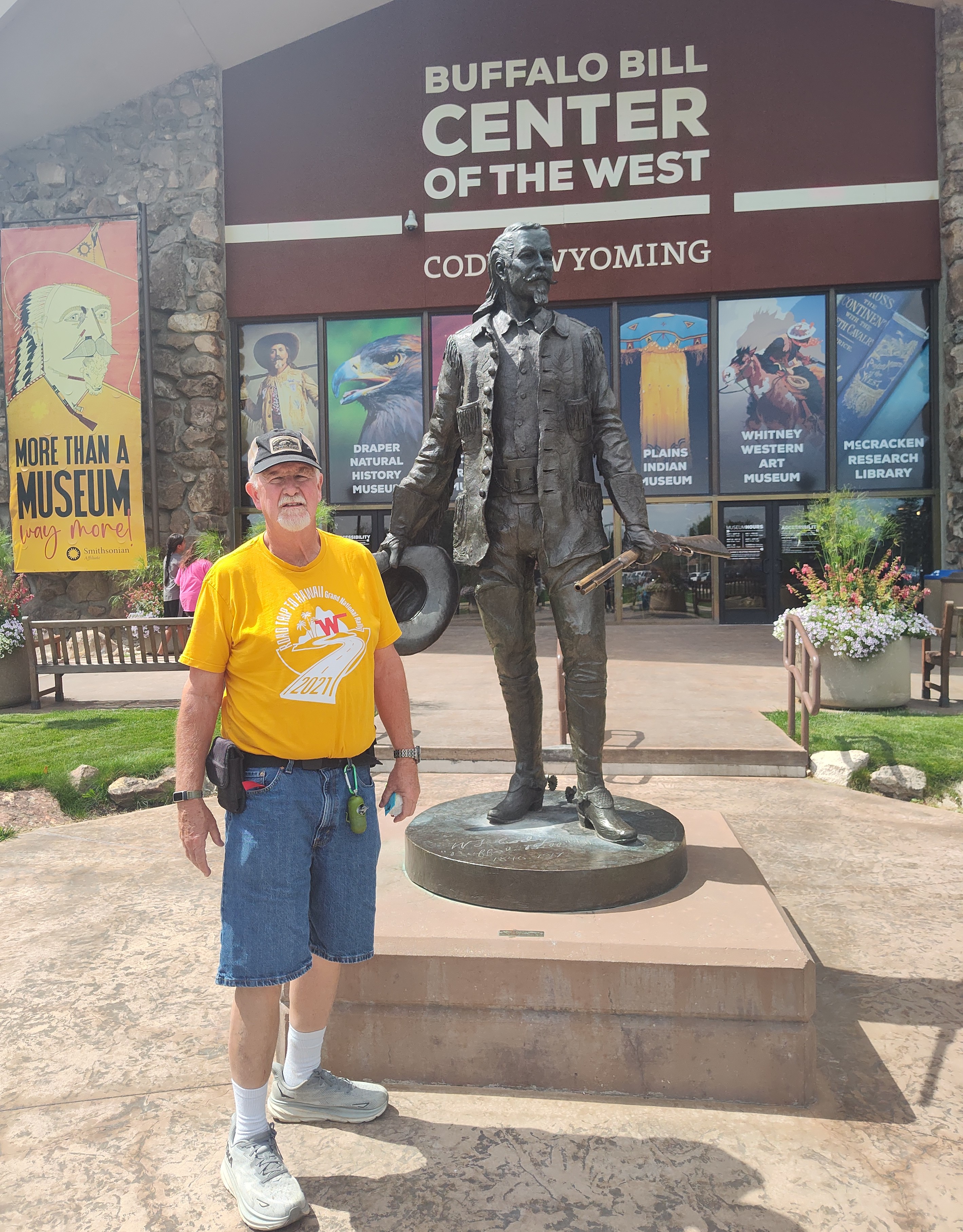 Jerald standing in front of another Wild Bill Statue